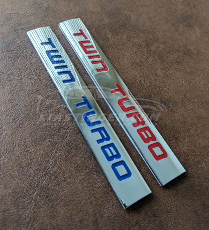twin turbo badge in red and blue
