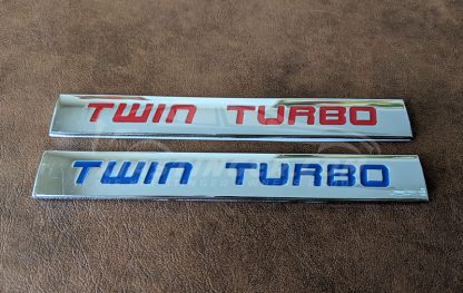 twin turbo badge in red and blue